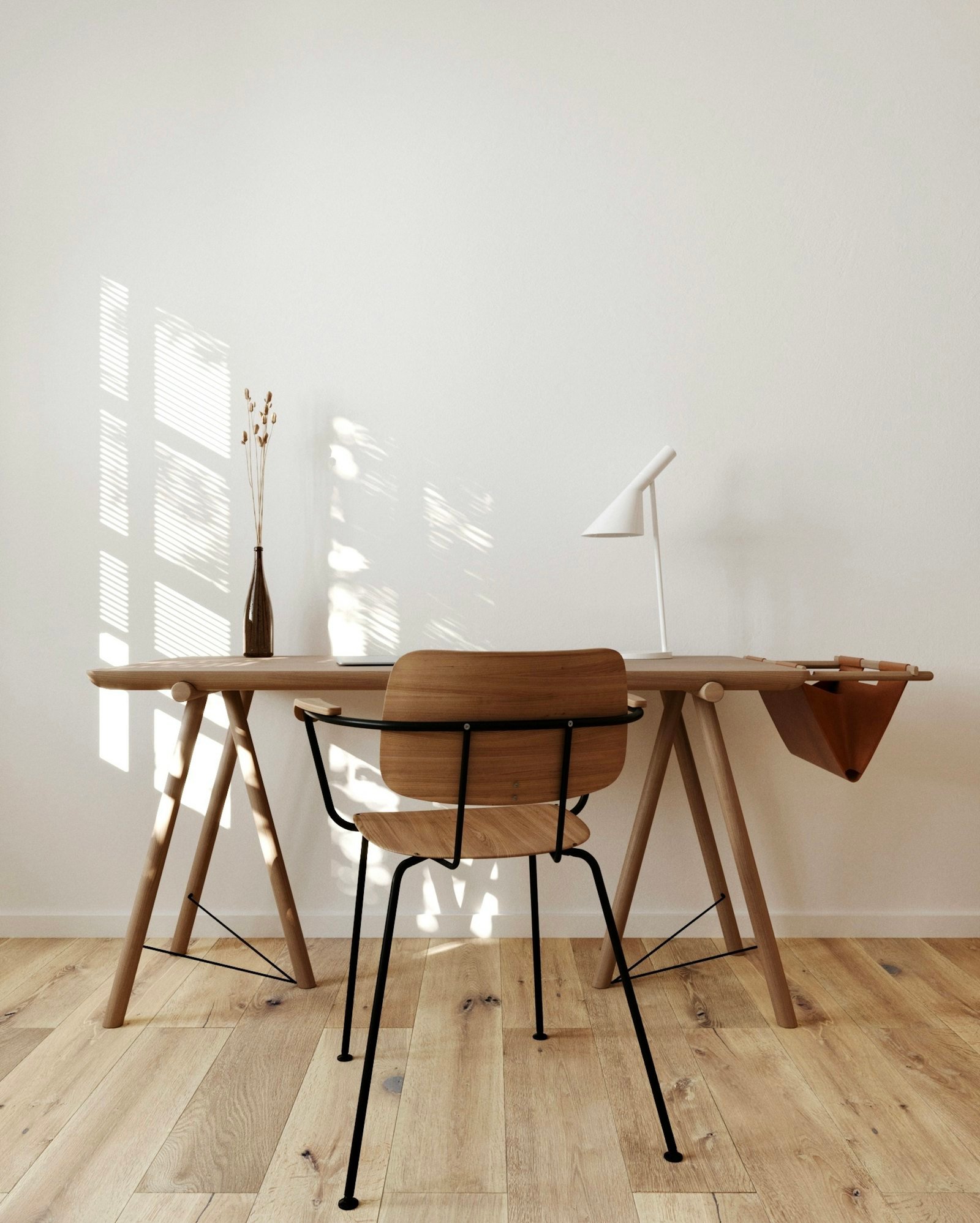 A study with a wooden desk and chair